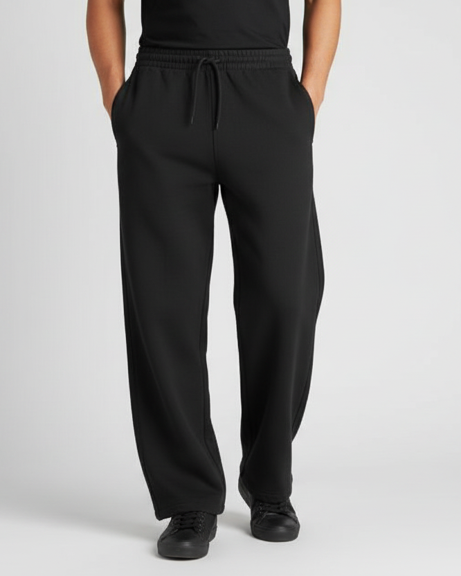 Euphor Bliss unisex black loose-fit sweatpants with an elastic drawstring waist and side pockets on a model