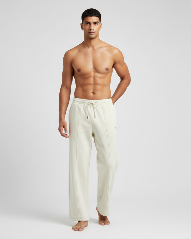 Euphor Bliss unisex cream sweatpants in a relaxed loose-fit terry fabric with a drawstring waist and front pockets.