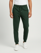 Euphor Bliss unisex forest green cotton joggers with a tapered fit, elastic waistband, and ribbed ankle cuffs.