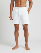 Euphor Bliss men's white terry shorts with an elastic drawstring waistband and side pockets on a shirtless model